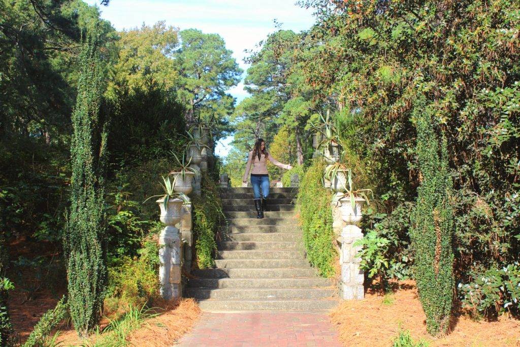 Girl walking down tree-lined steps