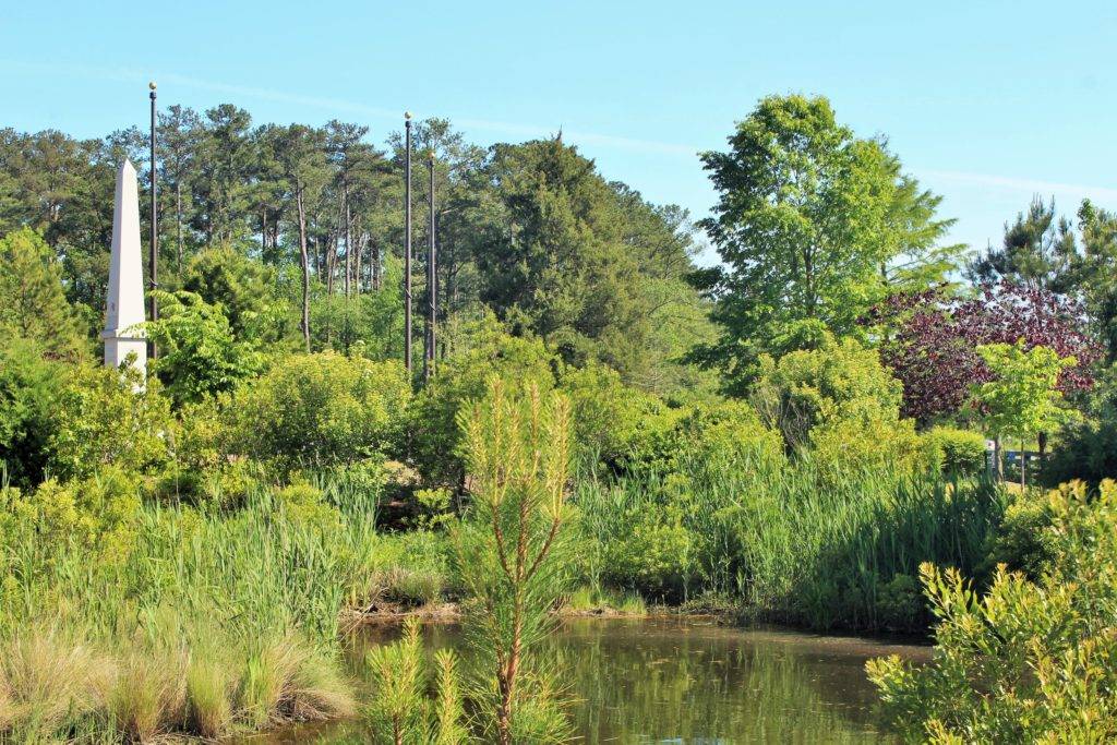 lush gardens with a tall monument