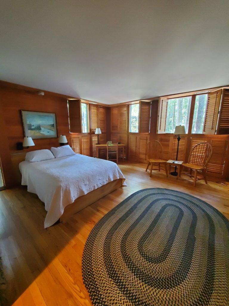 cozy wood-paneled room with floor-to ceiling windows at Middleton Place
