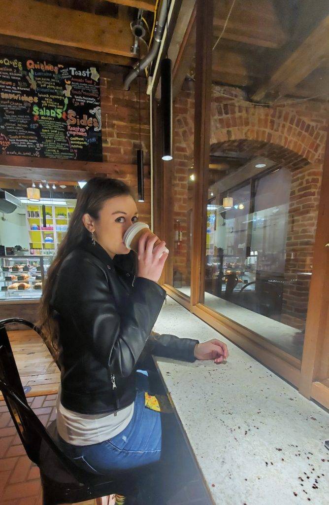 The Mandala Traveler enjoying coffee at the cafe du soleil bar-height counters