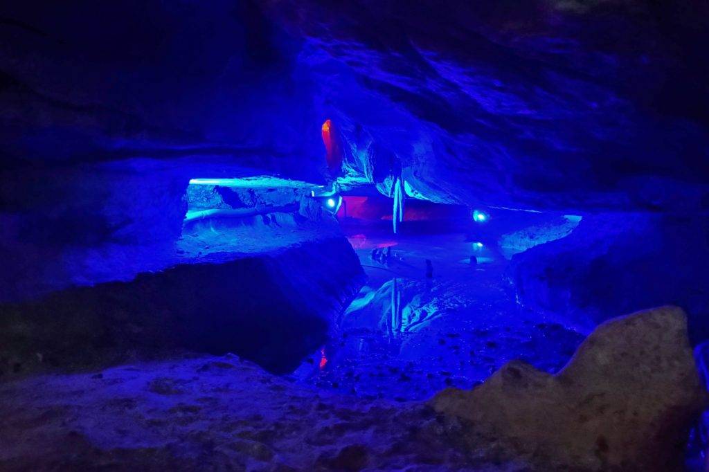 Mirror Lake Skyline Caverns. Undergournd lake showing the reflection of the ceiling lit with blue lights