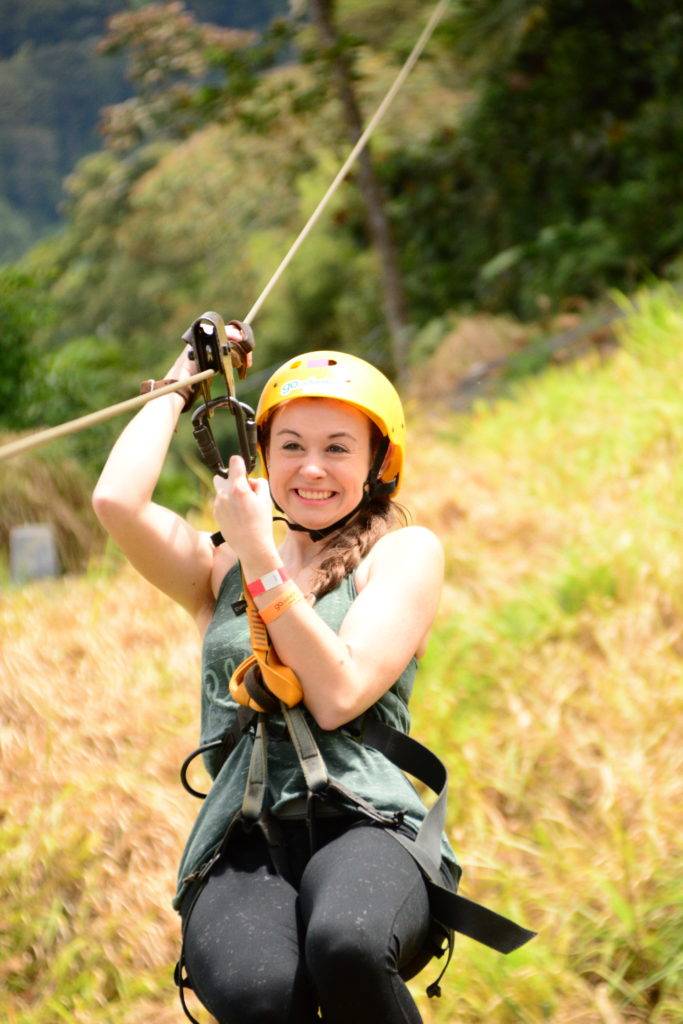 Girl zip lining in la fortuna costa rica