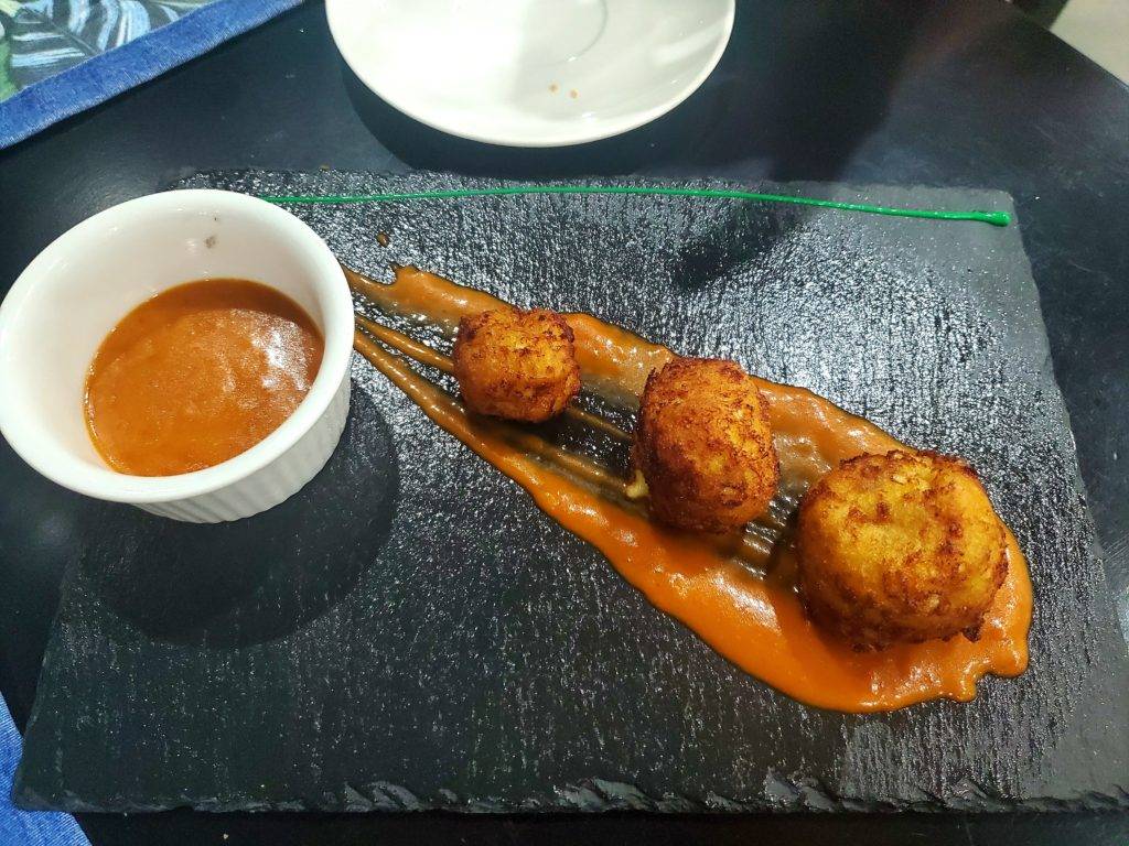 ripe plantain balls on a volcanic rock slab at montana de fuego