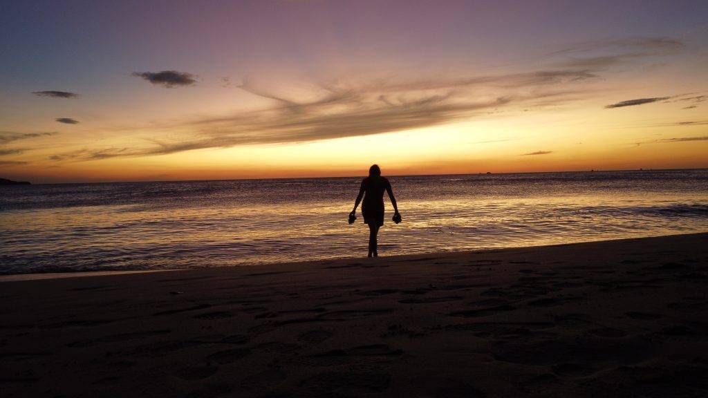 girl on a beach at sunset in Costa Rica