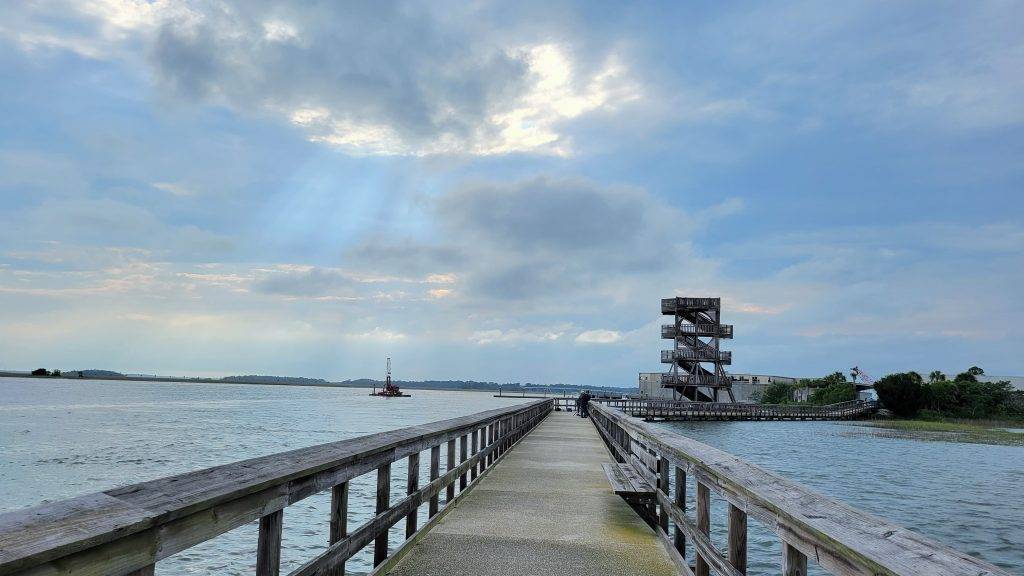 wooden boardwalk and observation tower over water. port royal sc