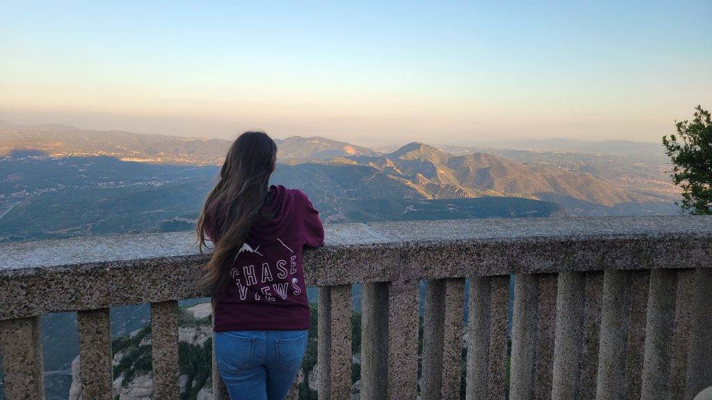 girl looking over the mountains of Barcelona