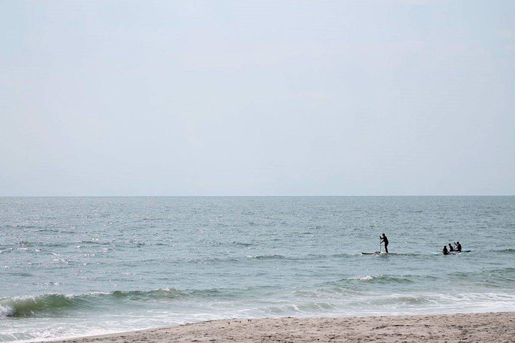 People SUP in the waters around Chincoteague and Assateague islands