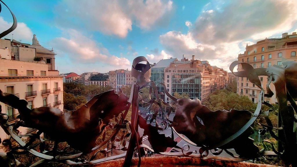 Passeig de Gracia as seen through a window with a wrought-iron accent piece