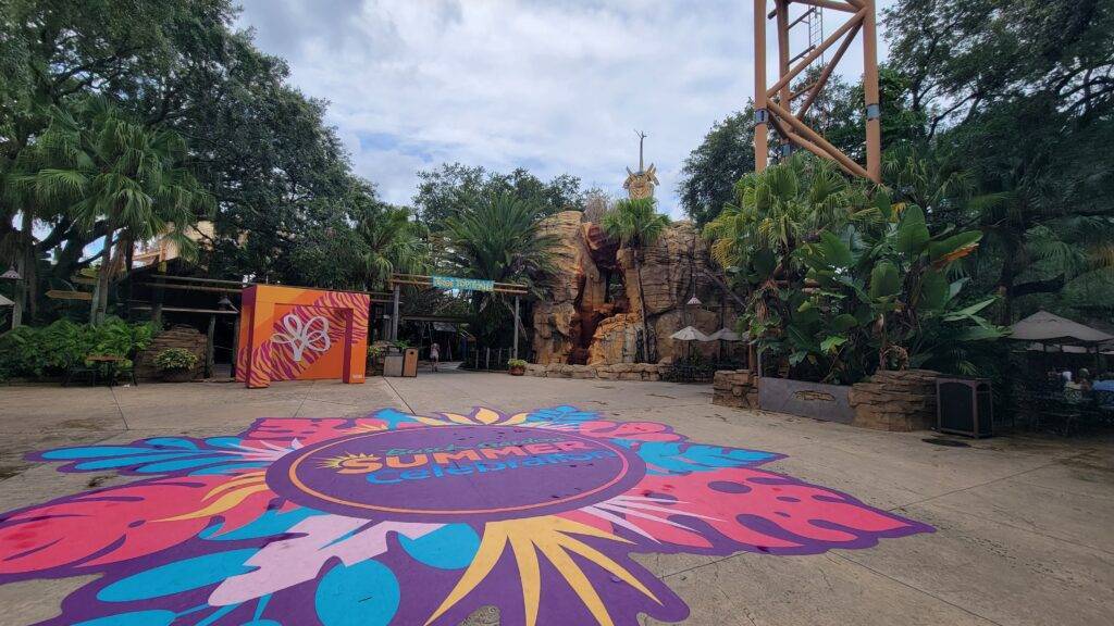 large Summer celebration mural at busch Gardens Tampa underneath a roller coaster