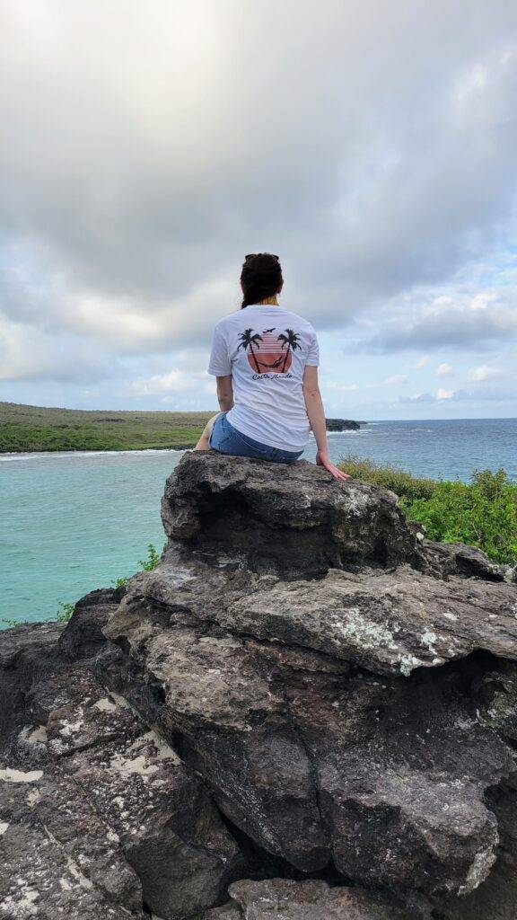 Girl on a rock in San Cristobal. Packing for Ecuador