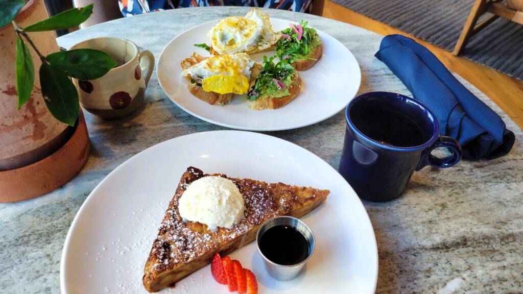 Breakfast spread on a marble table at the Catbird Hotel