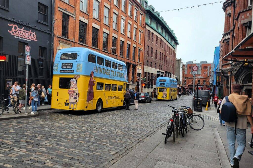 Two vintage tea trips buses waiting on Essex Street in Dublin