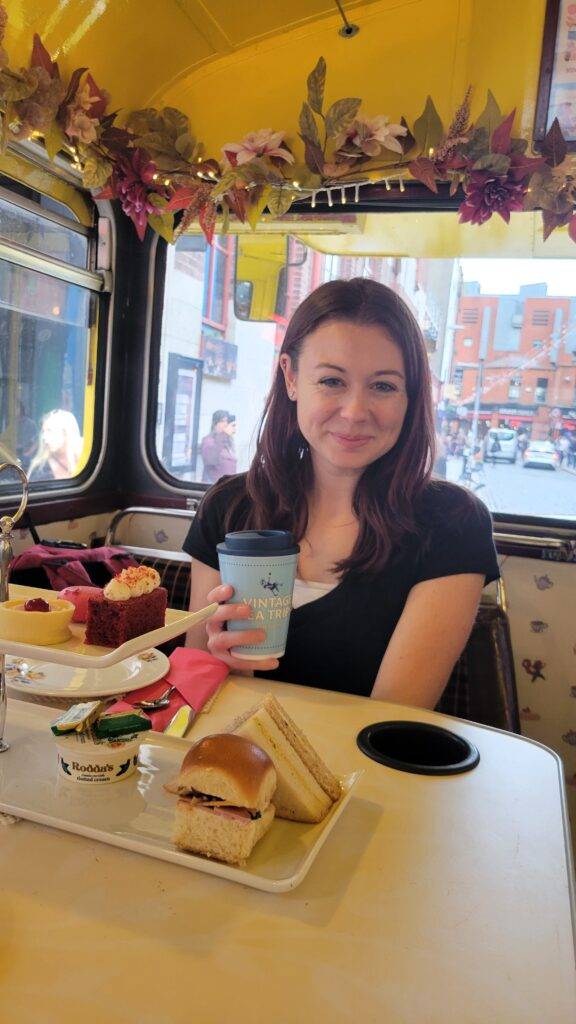 Interior of the Vintage Tea Trips bus with a selection of tea fare