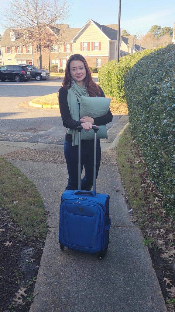 Girl with suitcase and travel accessories