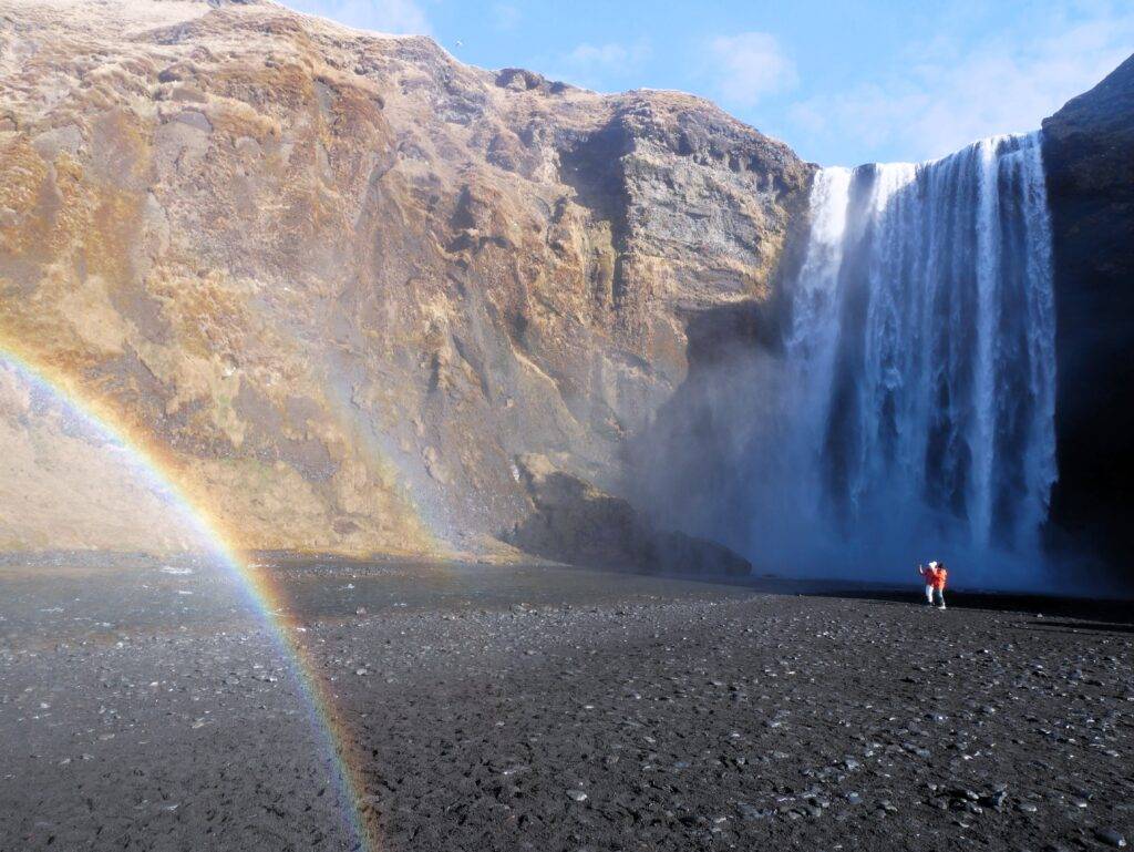 The famous Skogafoss Waterfall in Iceland with a double rainbow