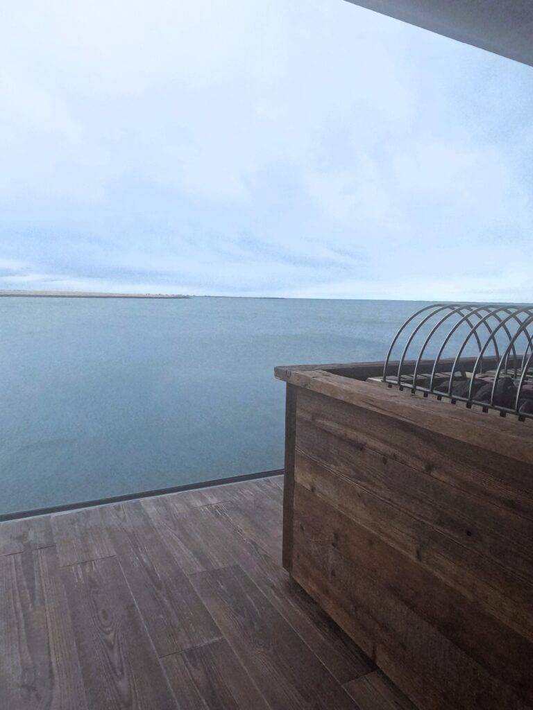 Sauna with a large window facing the ocean