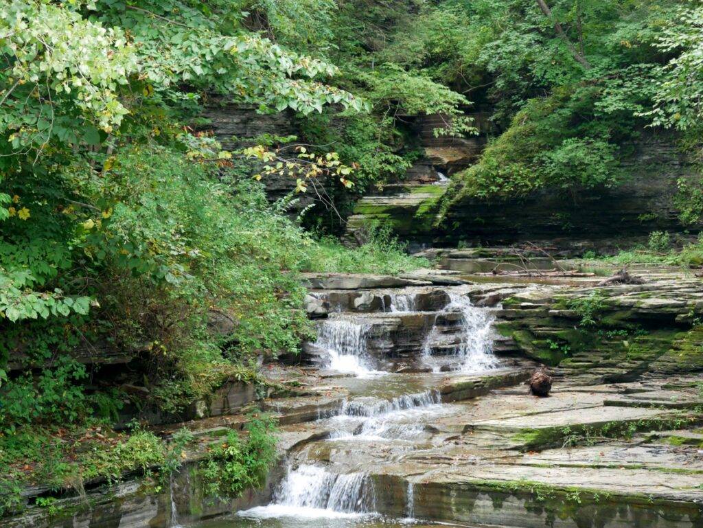 small waterfalls flowing down a rocky river