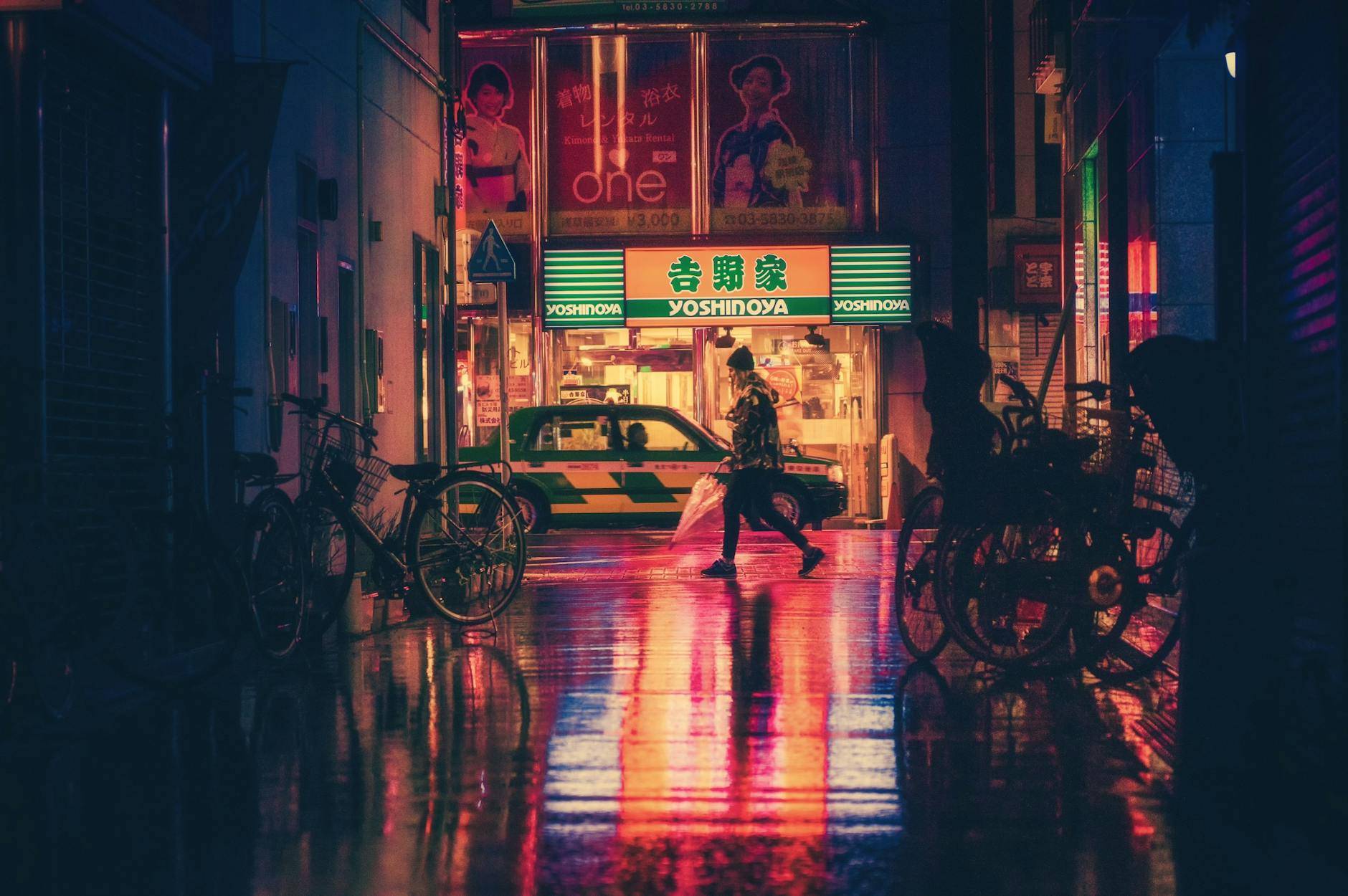 side view of woman in illuminated city at night