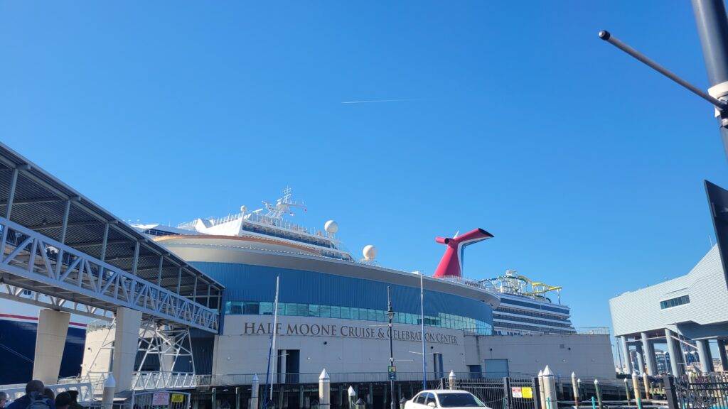 Half Moone Cruise & Celebration Center with the Carnival Sunshine docked behind