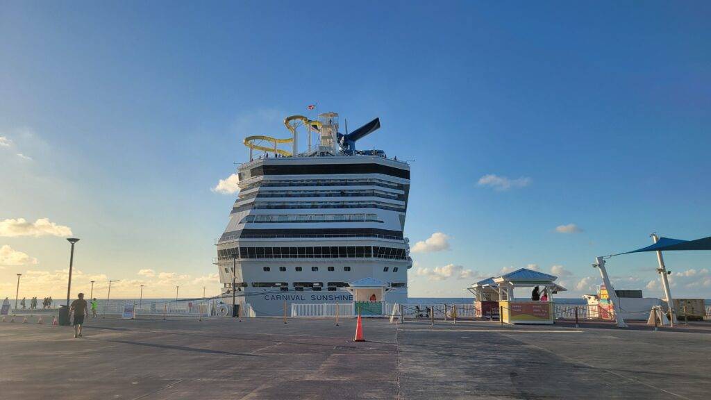 The Carnival Sunshine docked in Bimini, Bahamas at sunset